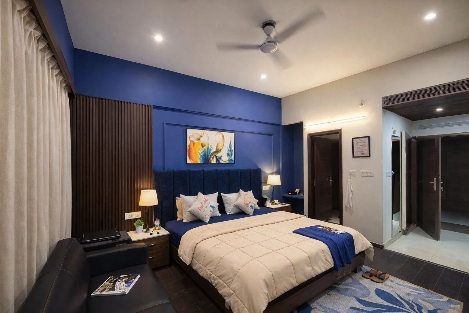 Bedroom with panelled walls and reading lamps