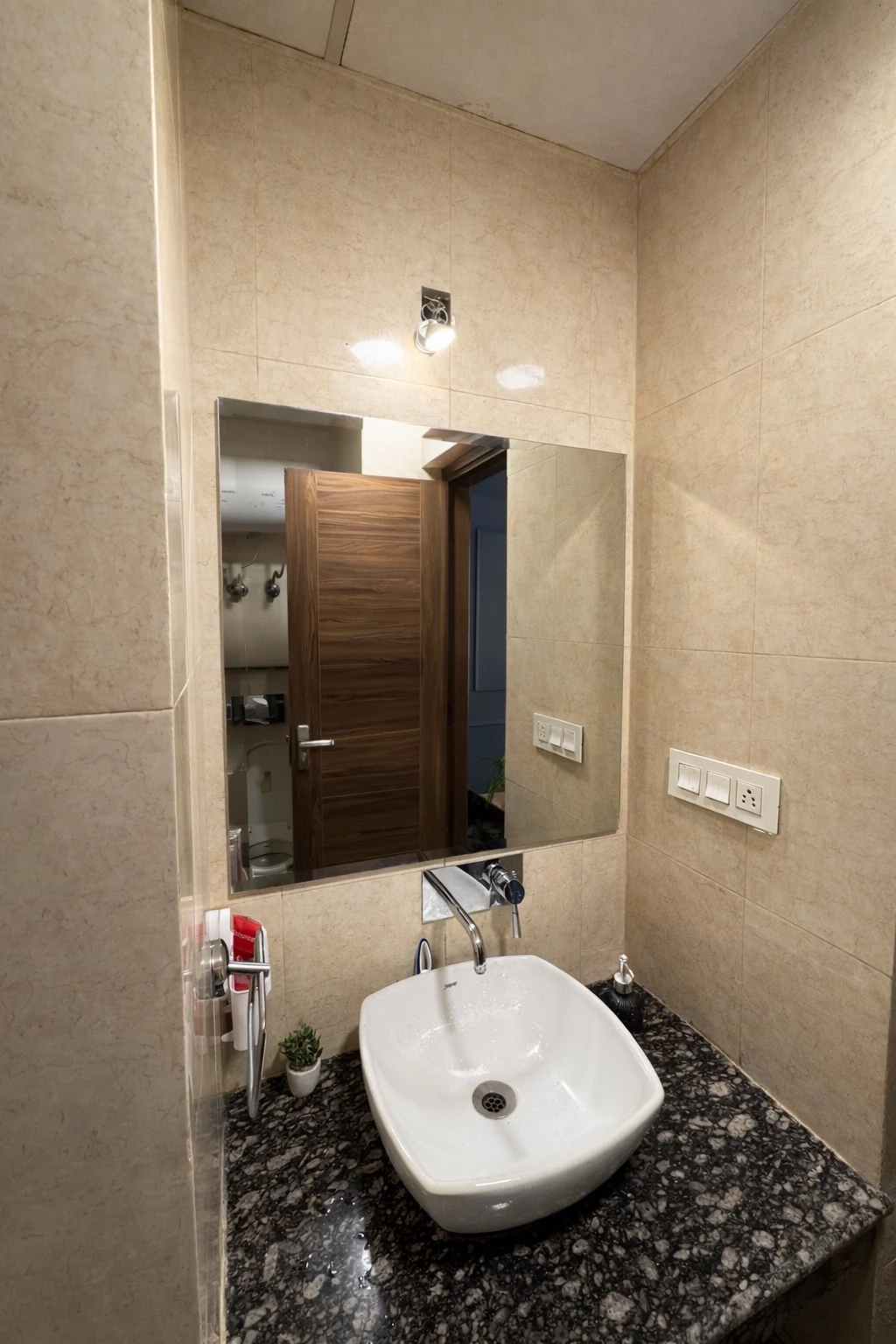 Marble bathroom with vanity and mirror